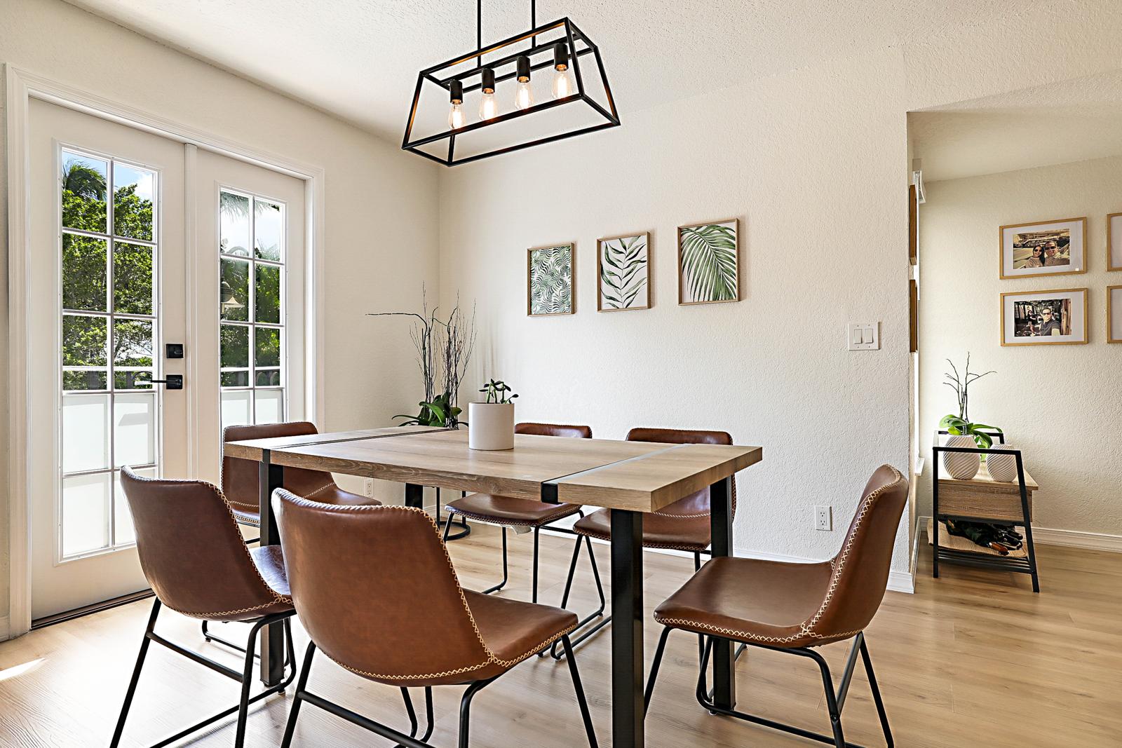 1105 Lake Shore Drive #205, Lake Park, FL 33403 - dining area with French doors