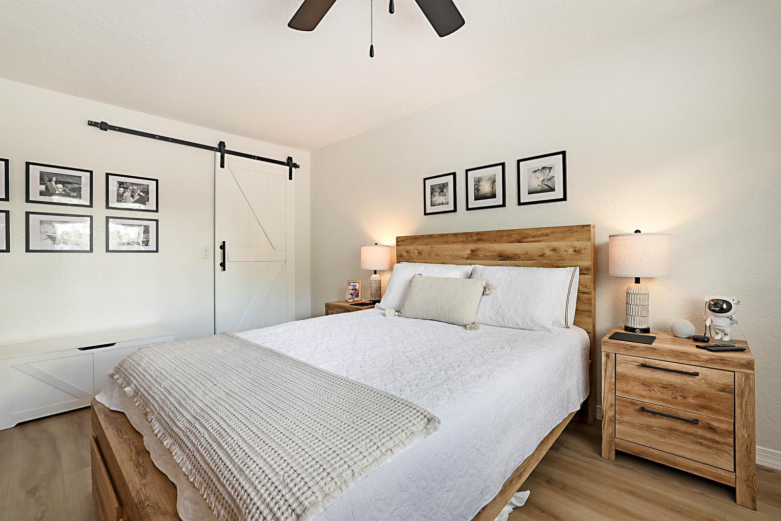 1105 Lake Shore Drive #205, Lake Park, FL 33403 - bedroom with barn-door closet