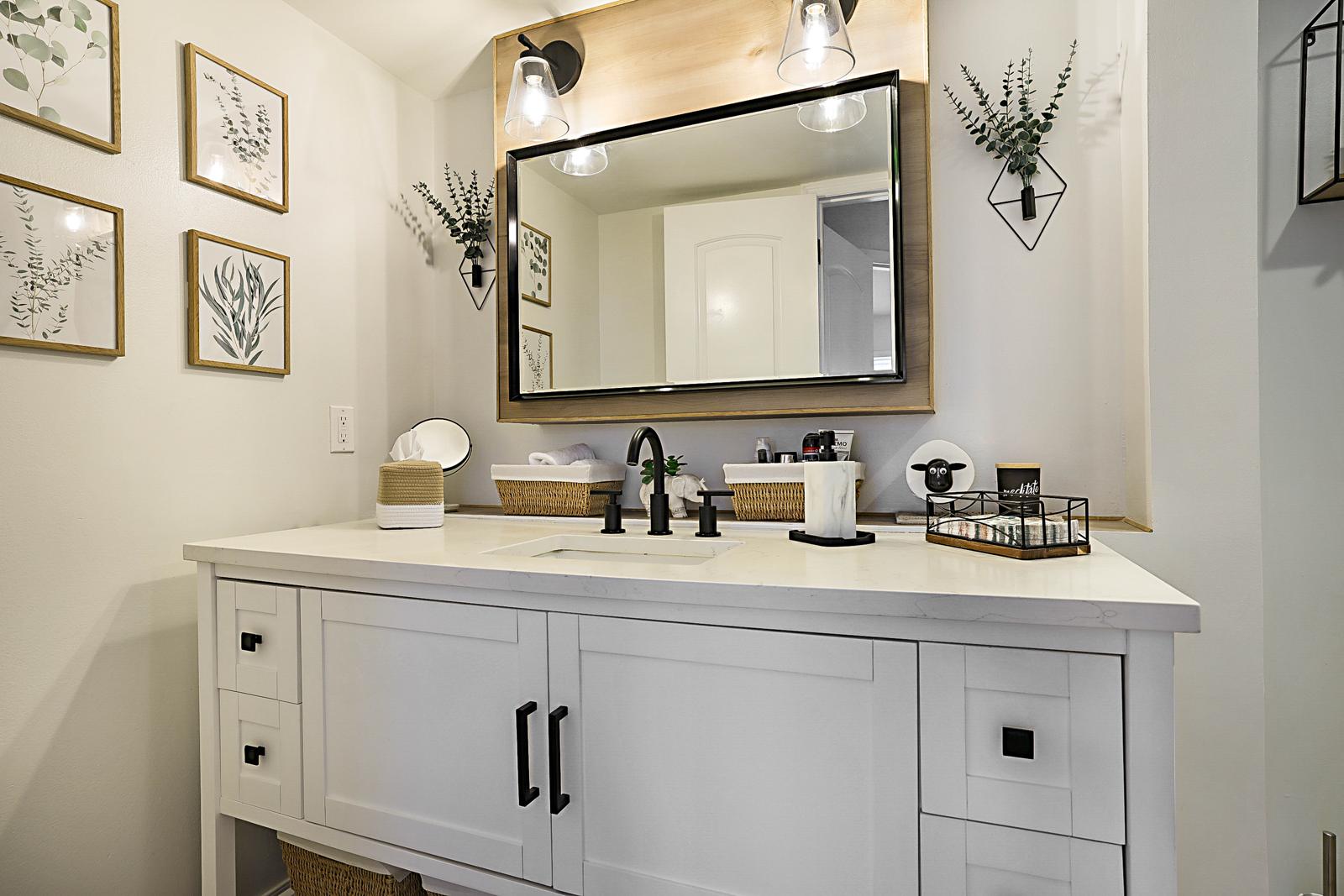 1105 Lake Shore Drive #205, Lake Park, FL 33403 - remodeled bathroom vanity with beveled mirror