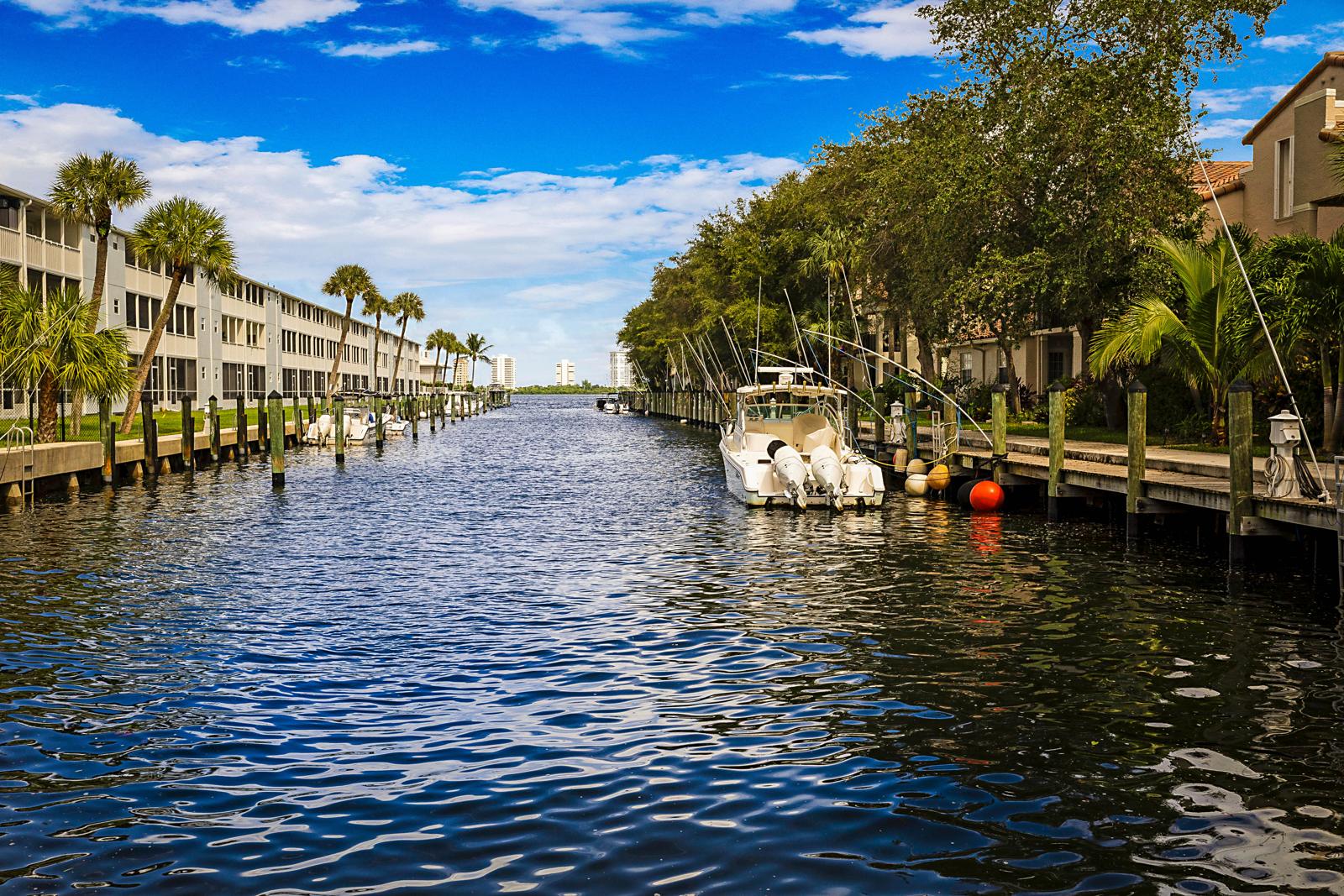 1105 Lake Shore Drive #205, Lake Park, FL 33403 - canal through the Bay Reach community with docks
