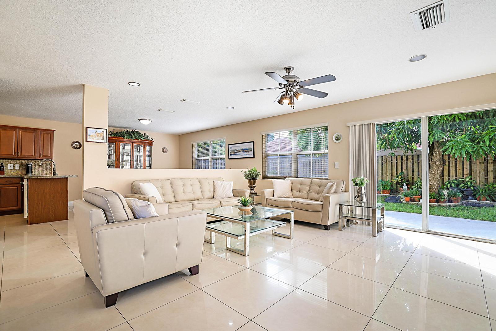 6666 Saltaire Terrace, Margate, FL 33063 - living room with sliding glass doors to the patio