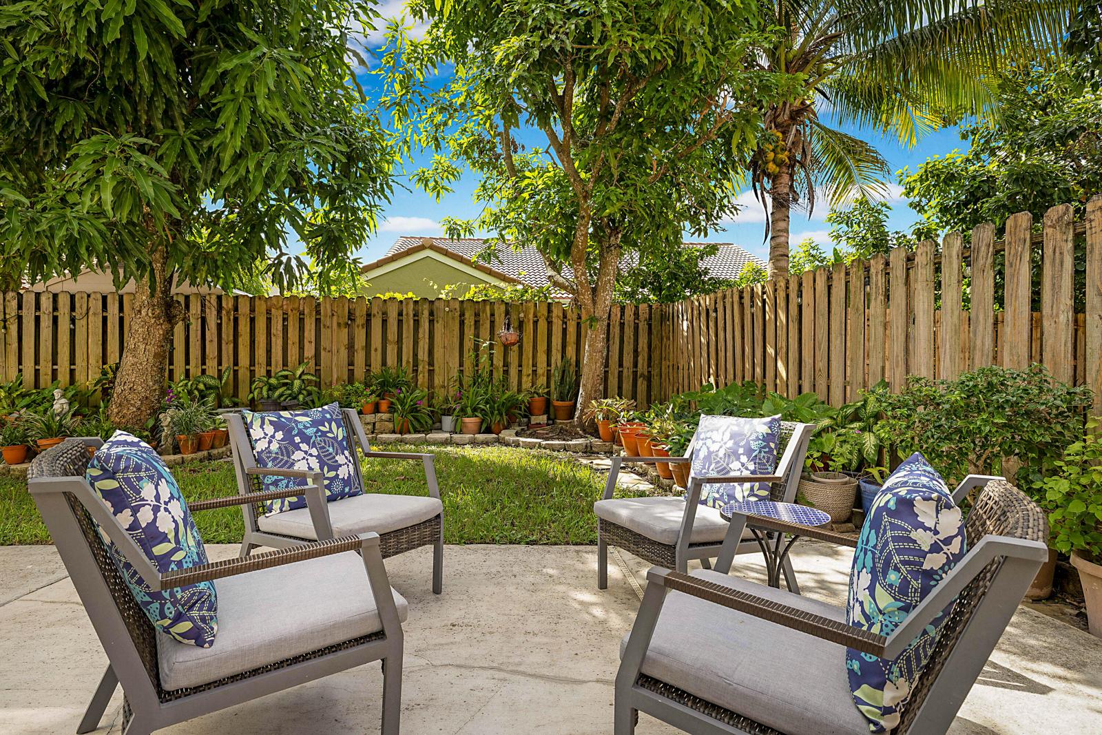 6666 Saltaire Terrace, Margate, FL 33063 - patio seating in the fenced backyard