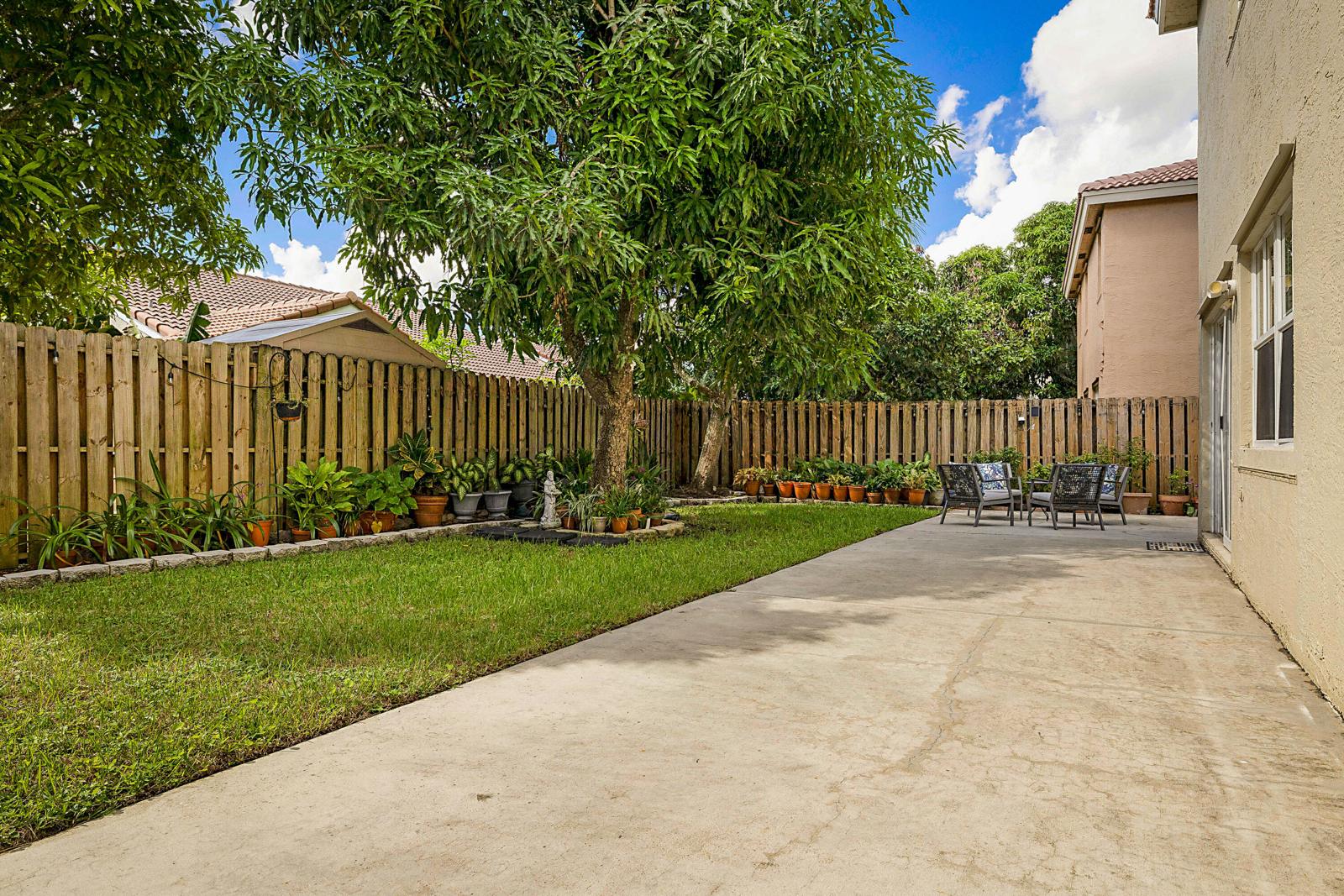 6666 Saltaire Terrace, Margate, FL 33063 - backyard lawn and fence