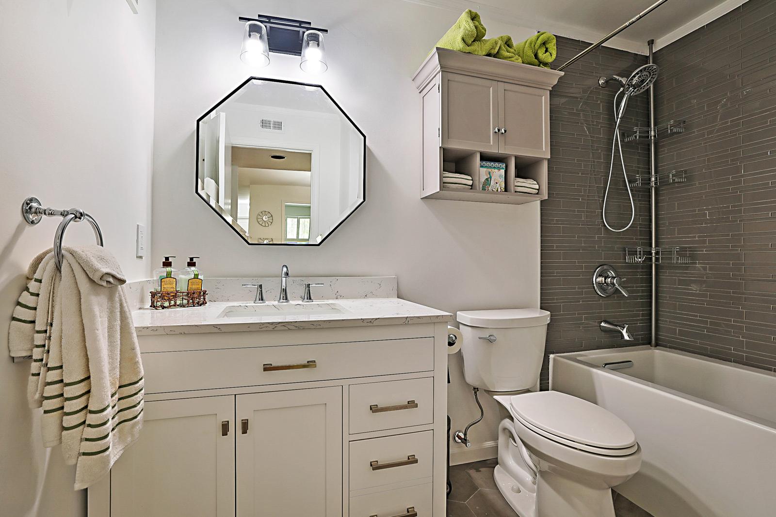 5032 Heatherhill Lane #6, Boca Raton, FL 33486 - renovated bathroom with new vanity and tiled tub surround