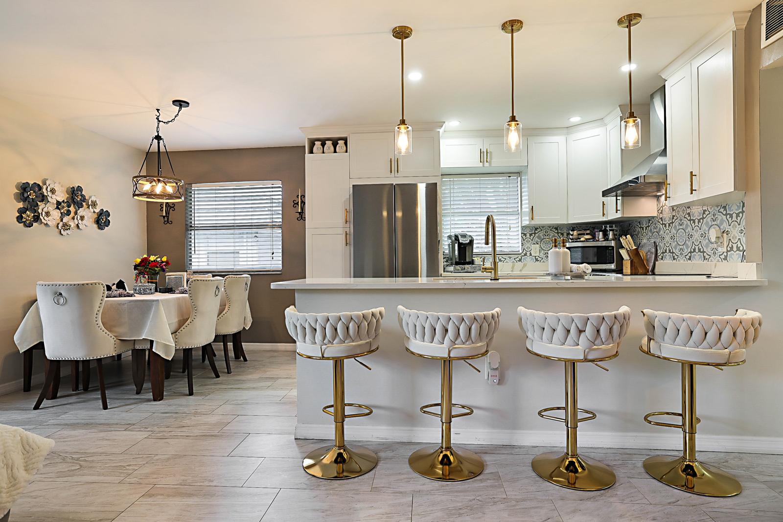136 Tuscany B, Delray Beach, FL 33446 - custom kitchen with island seating and pendant lights