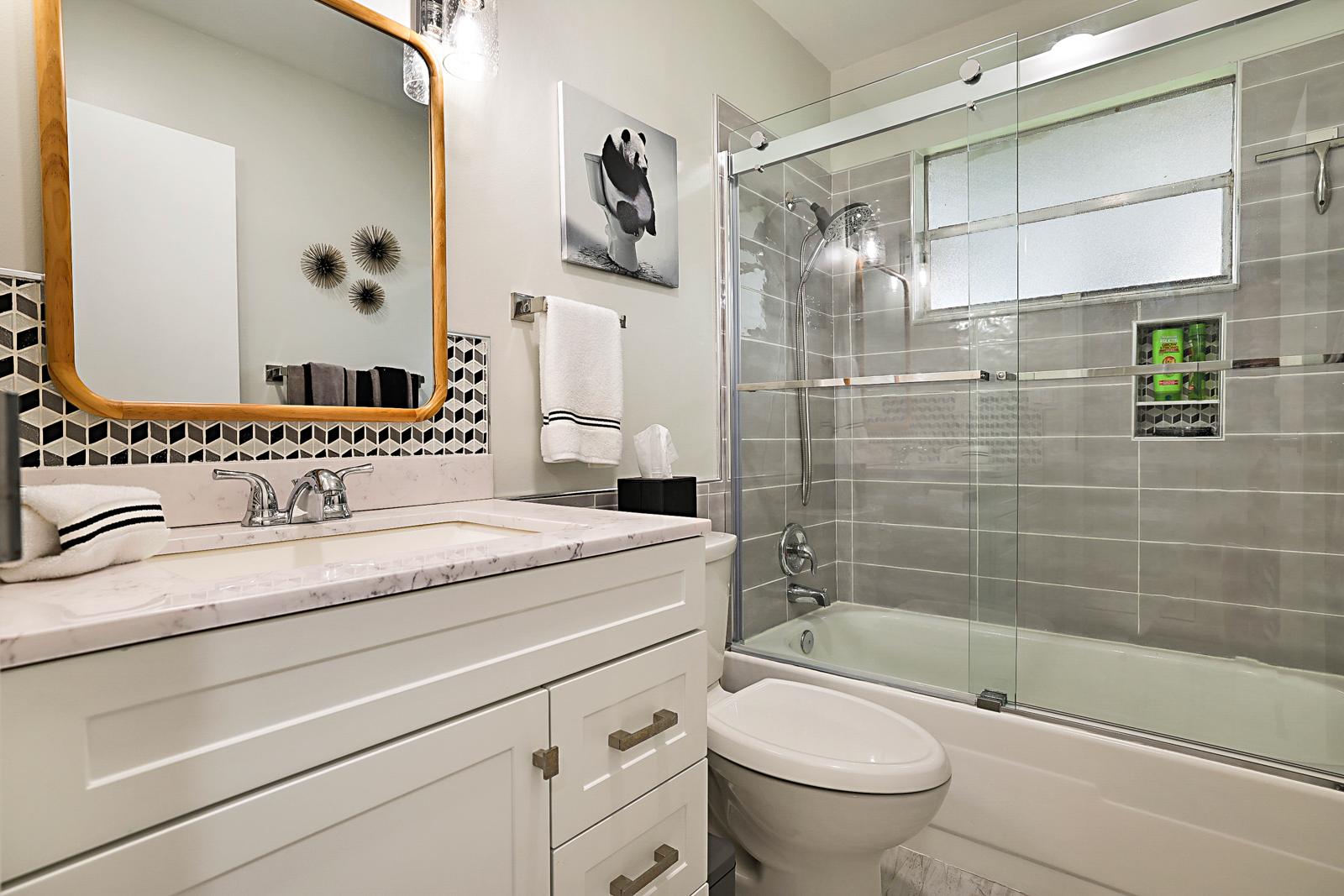 136 Tuscany B, Delray Beach, FL 33446 - renovated bathroom with glass shower door