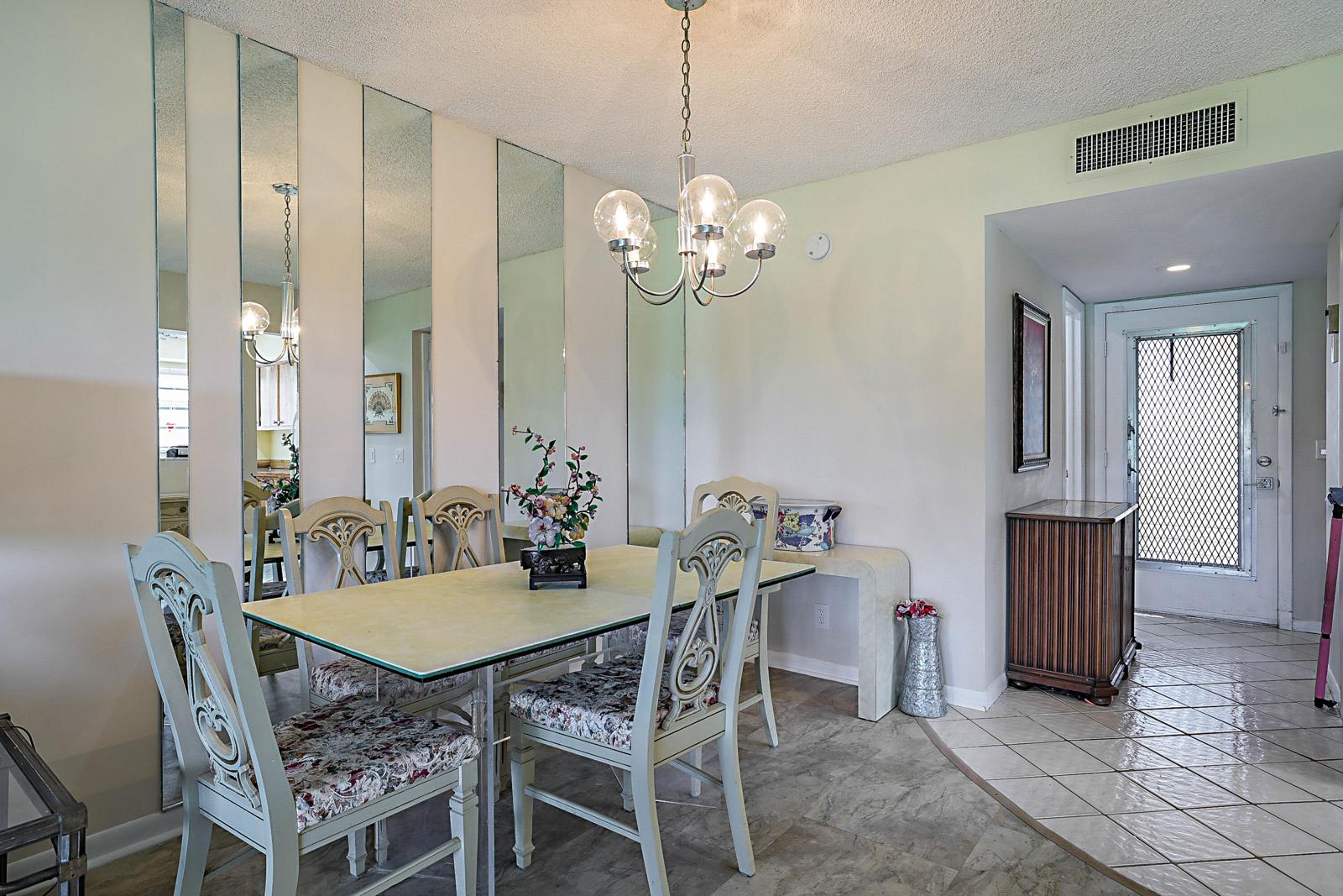 76 Capri B, Delray Beach, FL 33484 - dining area with chandelier
