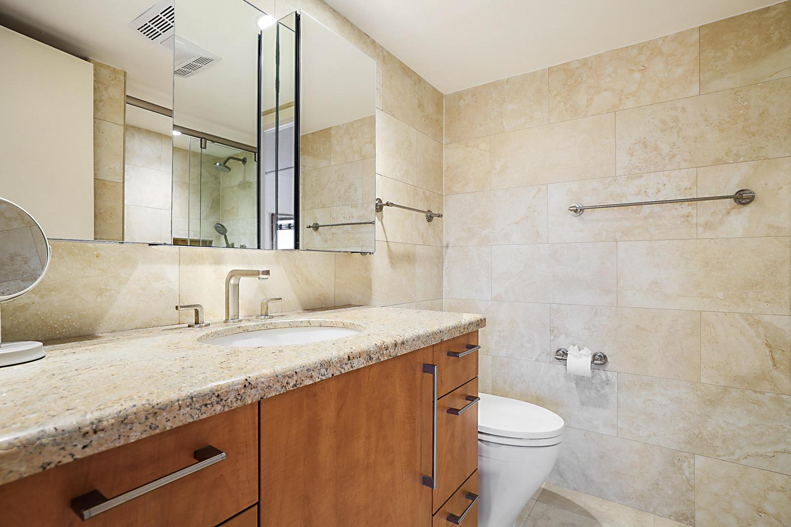 3114 S Ocean Boulevard #509, Highland Beach, FL 33487 - remodeled bathroom with granite vanity